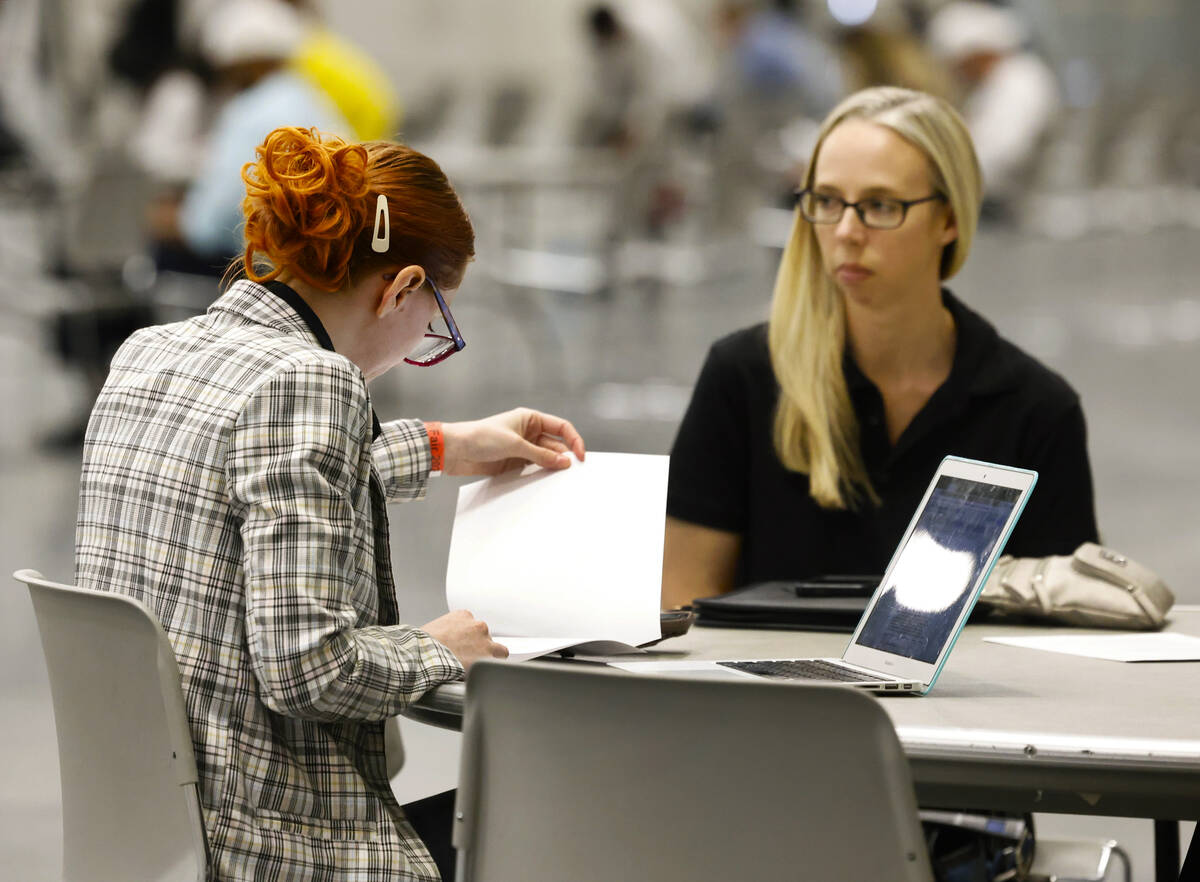 Ashley Warburton, left, HR resources manager at Boys and Girls Clubs of Southern Nevada, review ...