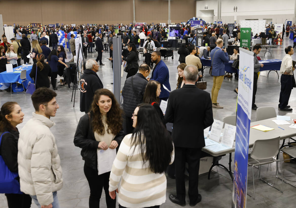 Job seekers visit booths during the annual Spring Job Fair at the Las Vegas Convention Center, ...