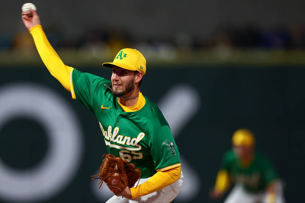 Oakland Athletics starting pitcher Mitch Spence (69) throws to the Milwaukee Brewers during a M ...