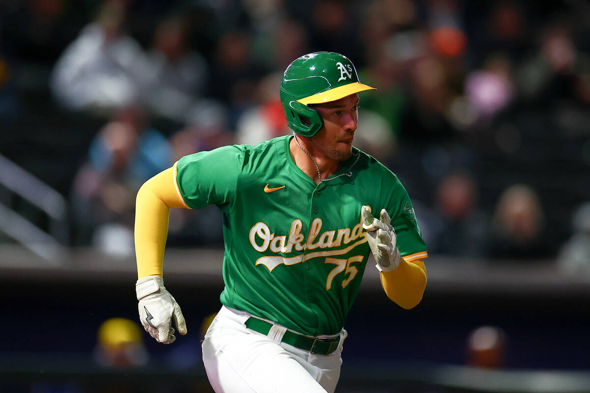 Oakland Athletics Drew Lugbauer (75) runs to first base during a Major League Baseball spring t ...