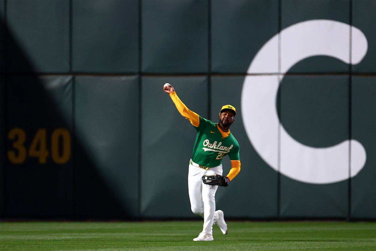 Oakland Athletics outfielder Miguel Andujar (22) throws in field during a Major League Baseball ...
