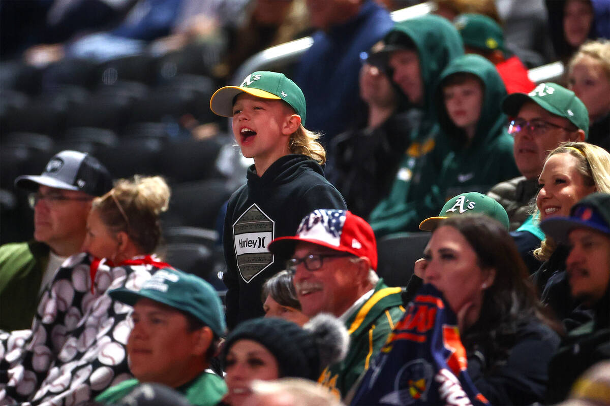 A young fan cheers for the Oakland Athletics during a Major League Baseball spring training gam ...