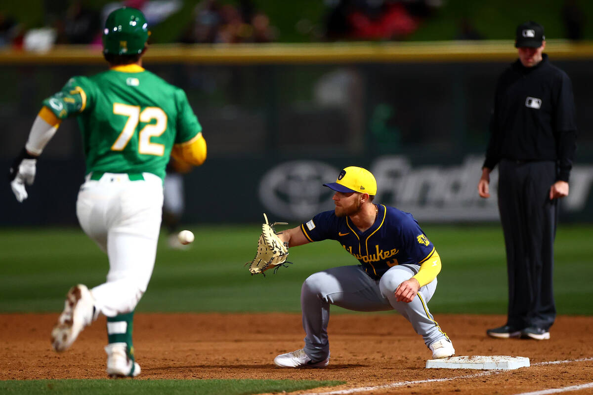 Milwaukee Brewers first baseman Jake Bauers (9) catches for an out against Oakland Athletics in ...