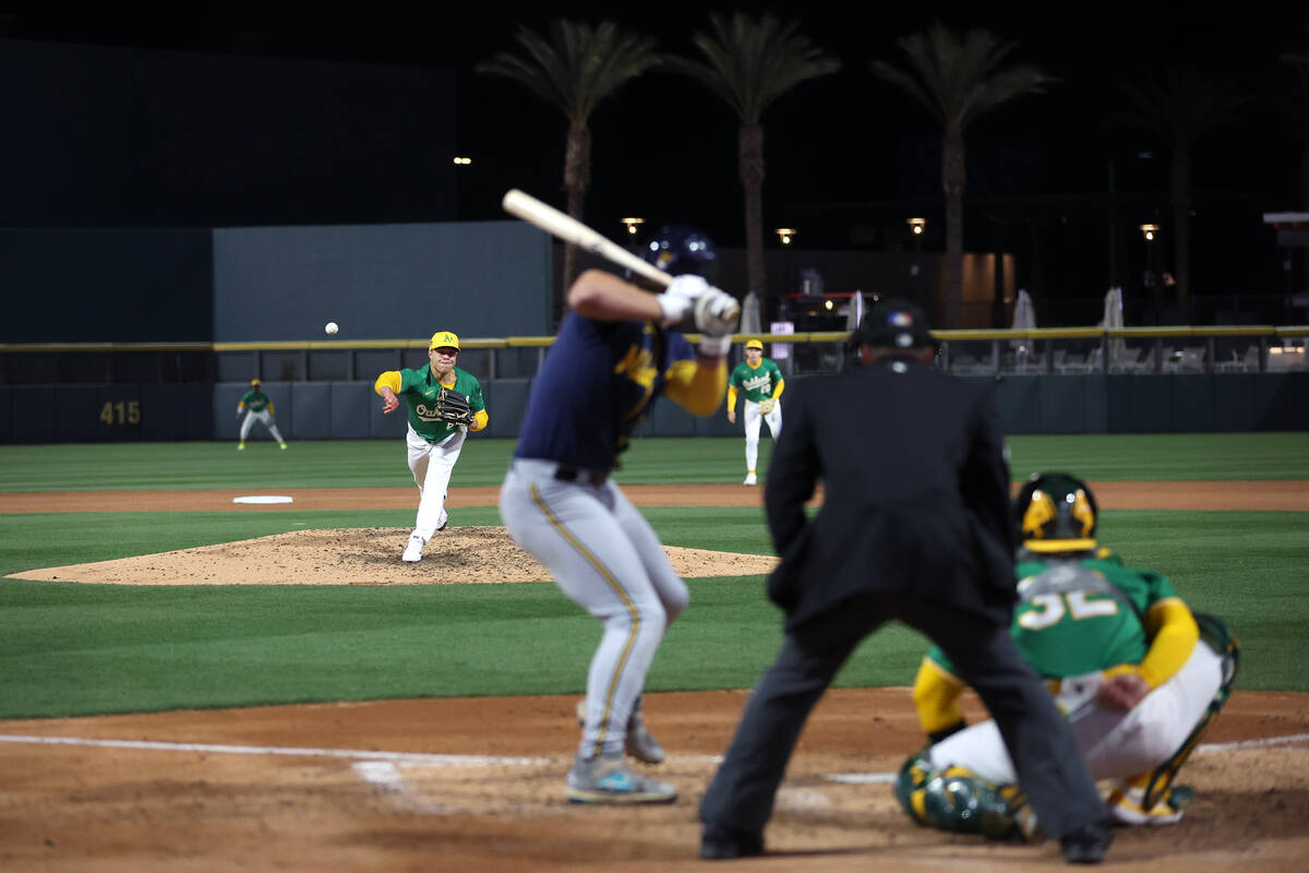 Oakland Athletics starting pitcher Mason Miller (19) throws to the Milwaukee Brewers during a M ...