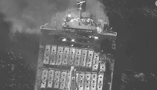 This black-and-white image released by the U.S. military's Central Command shows the fire aboar ...