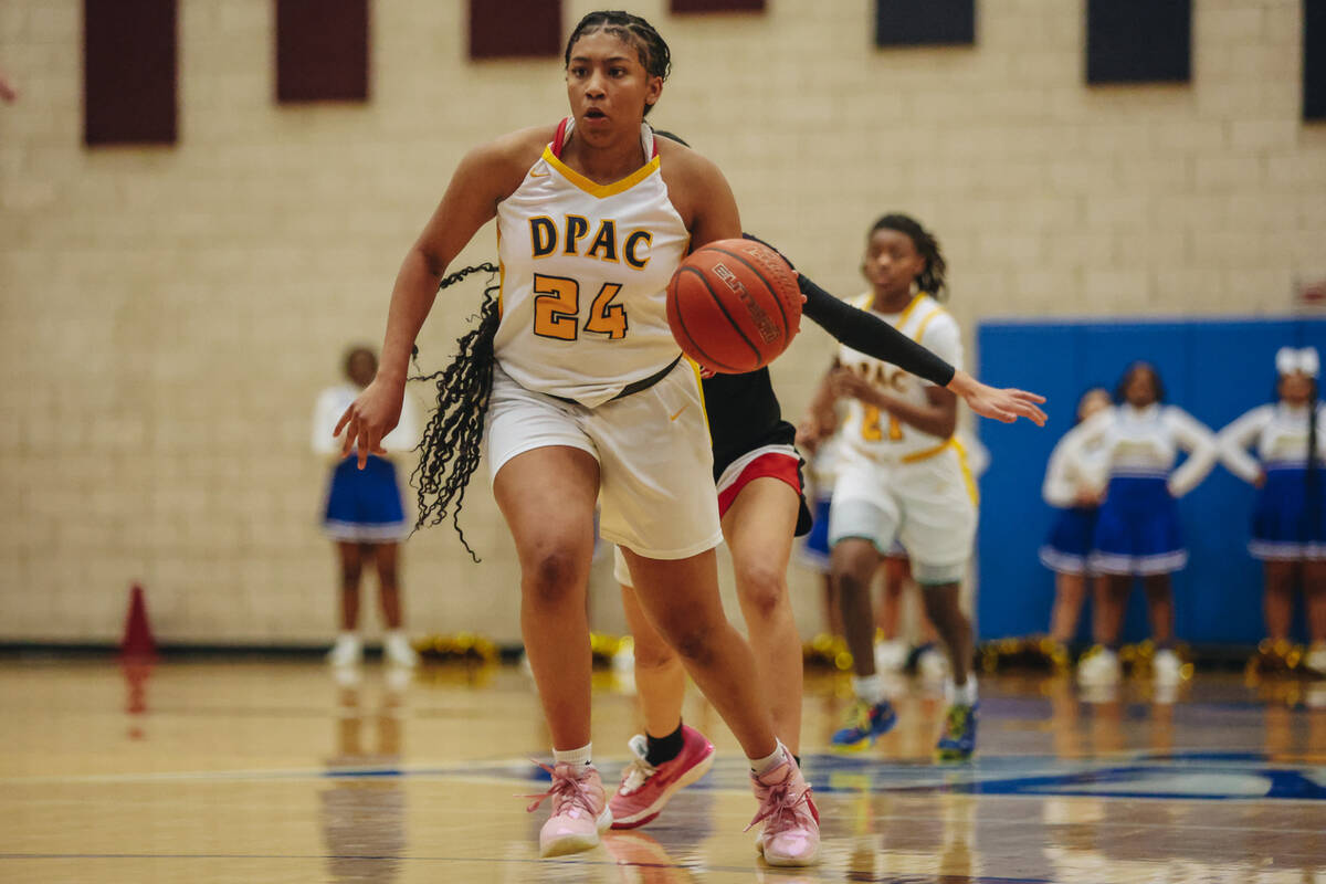 Democracy Prep’s Demi Thompson Lopez (24) dribbles the ball during a basketball game bet ...