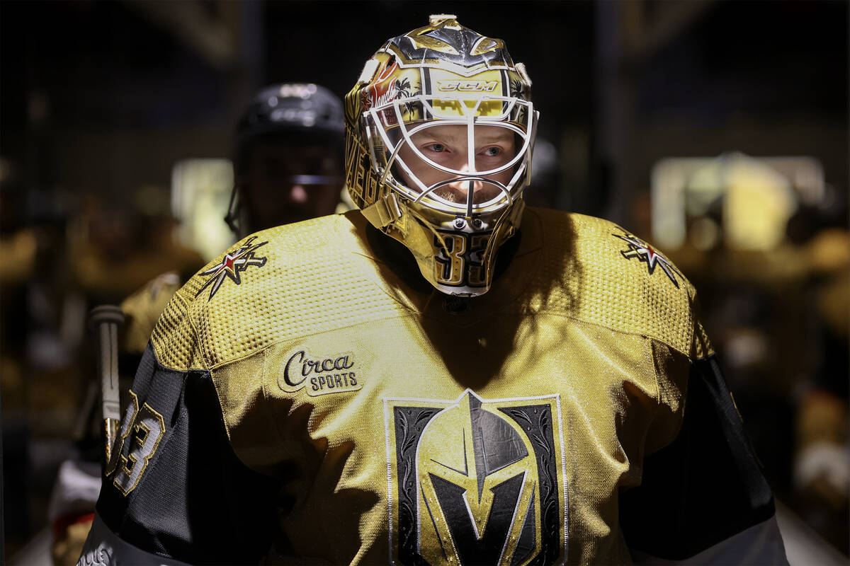 Golden Knights goaltender Adin Hill (33) takes to the ice for warmups before an NHL hockey game ...