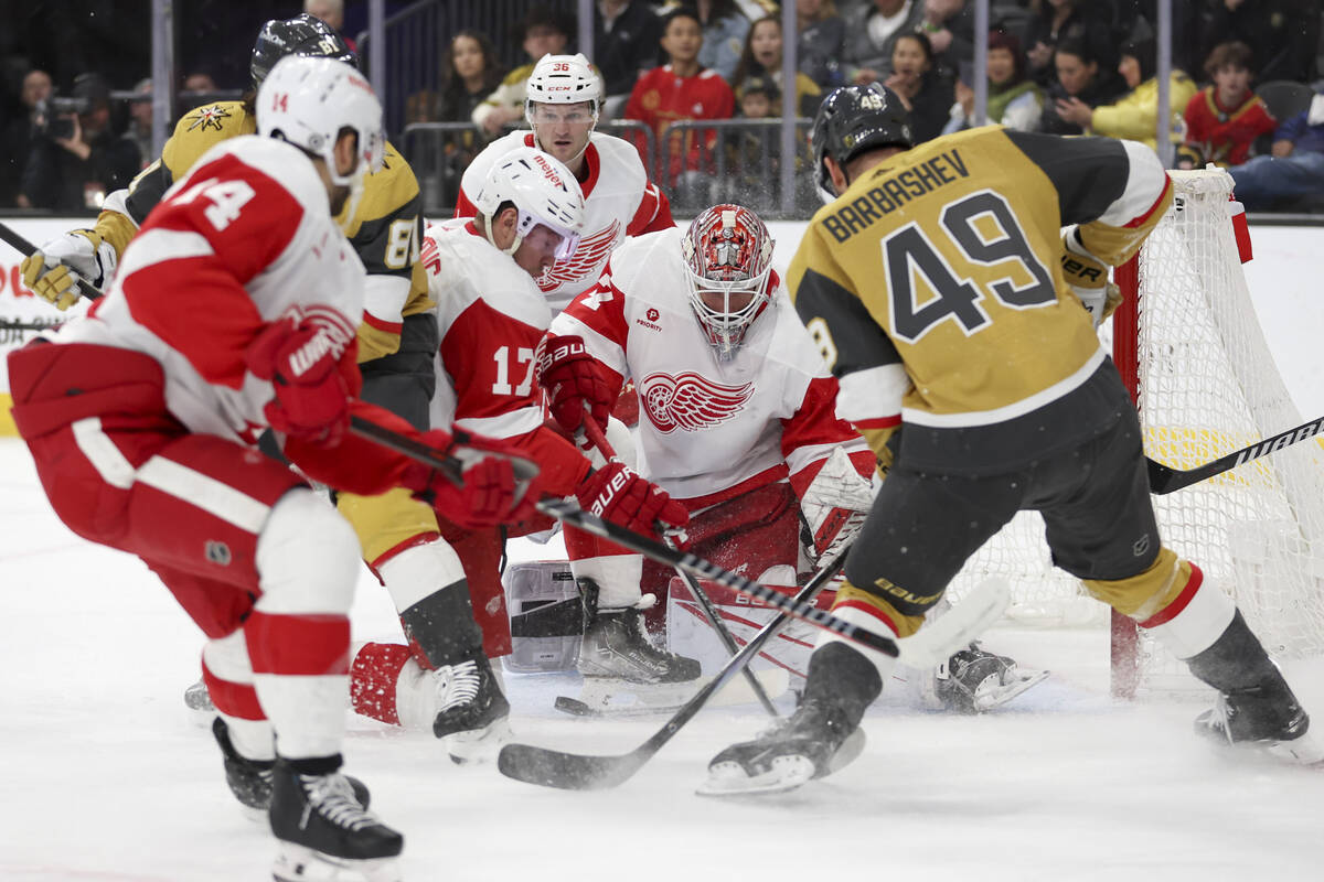Golden Knights center Ivan Barbashev (49) attempts to score on Red Wings goaltender James Reime ...