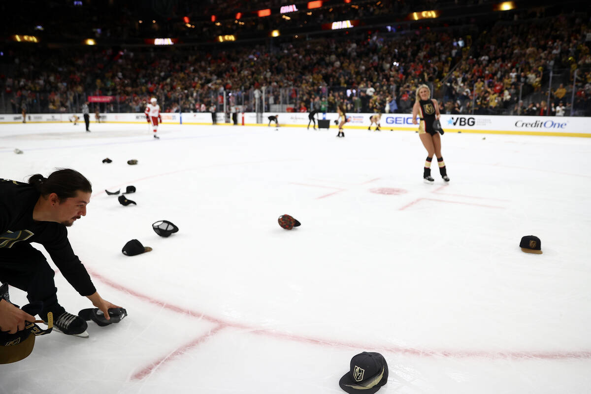 The Golden Knights ice crew retrieves hats after right wing Jonathan Marchessault scored a hat ...