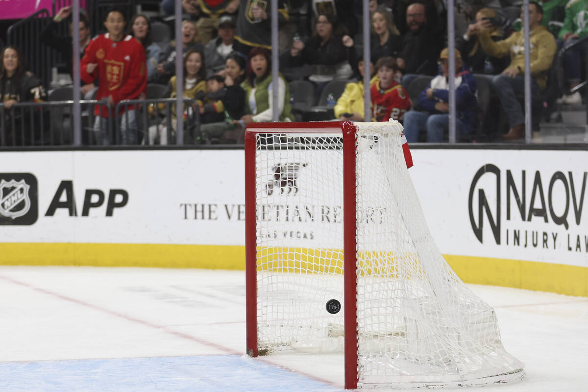 Golden Knights right wing Jonathan Marchessault, out of frame, scores an empty net goal during ...