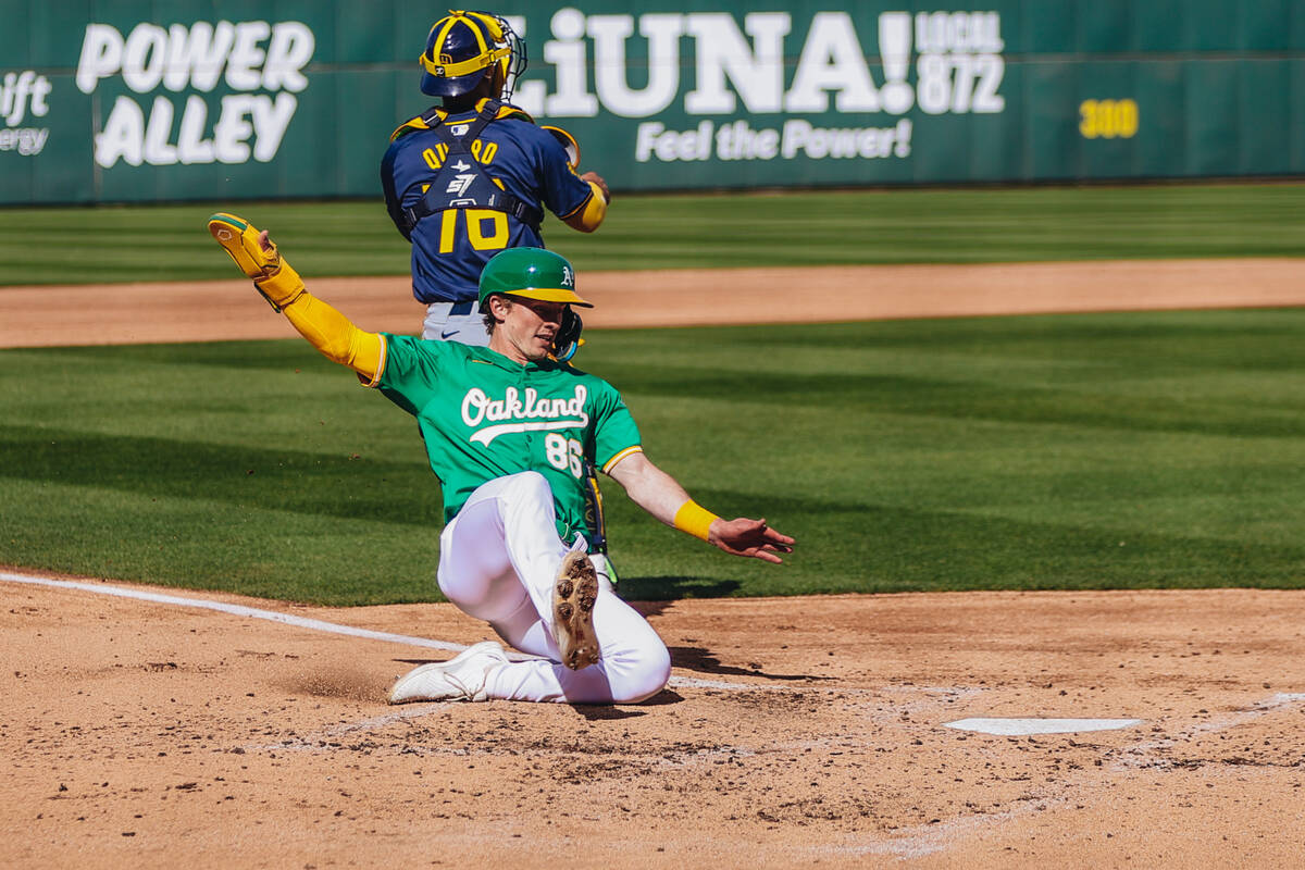 Oakland A’s infielder Cooper Bowman (86) slides to the home plate during a Big League We ...