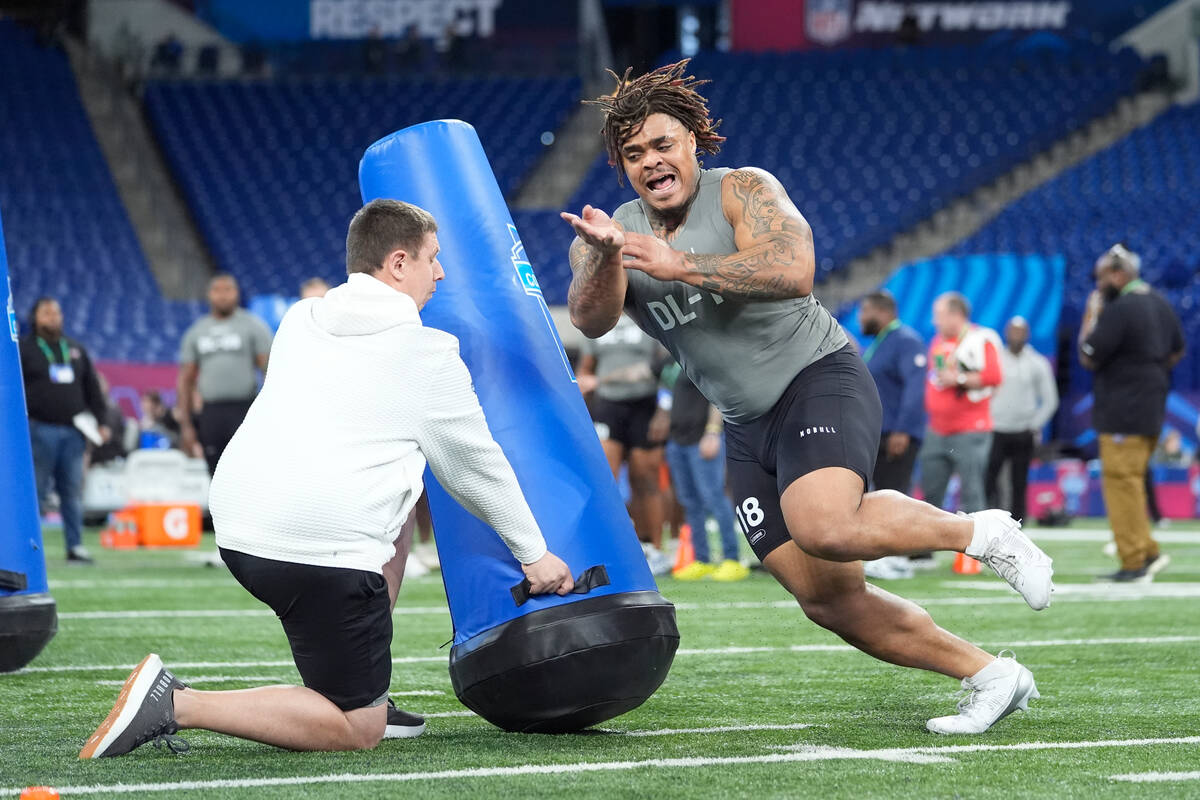 Texas defensive lineman Byron Murphy runs a drill at the NFL football scouting combine, Thursda ...
