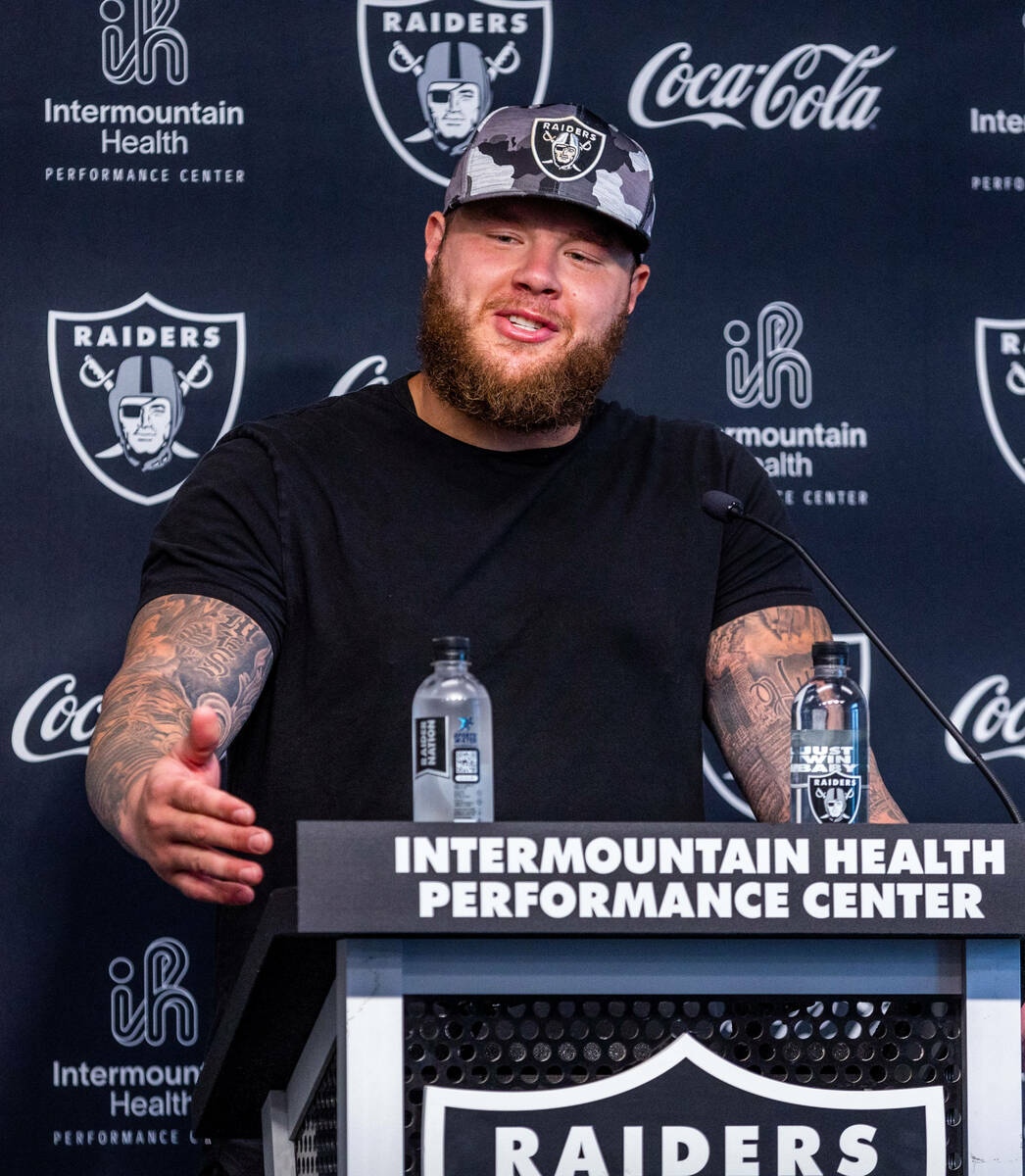 Raiders center Andre James (68) answers a question during a press conference in training camp a ...