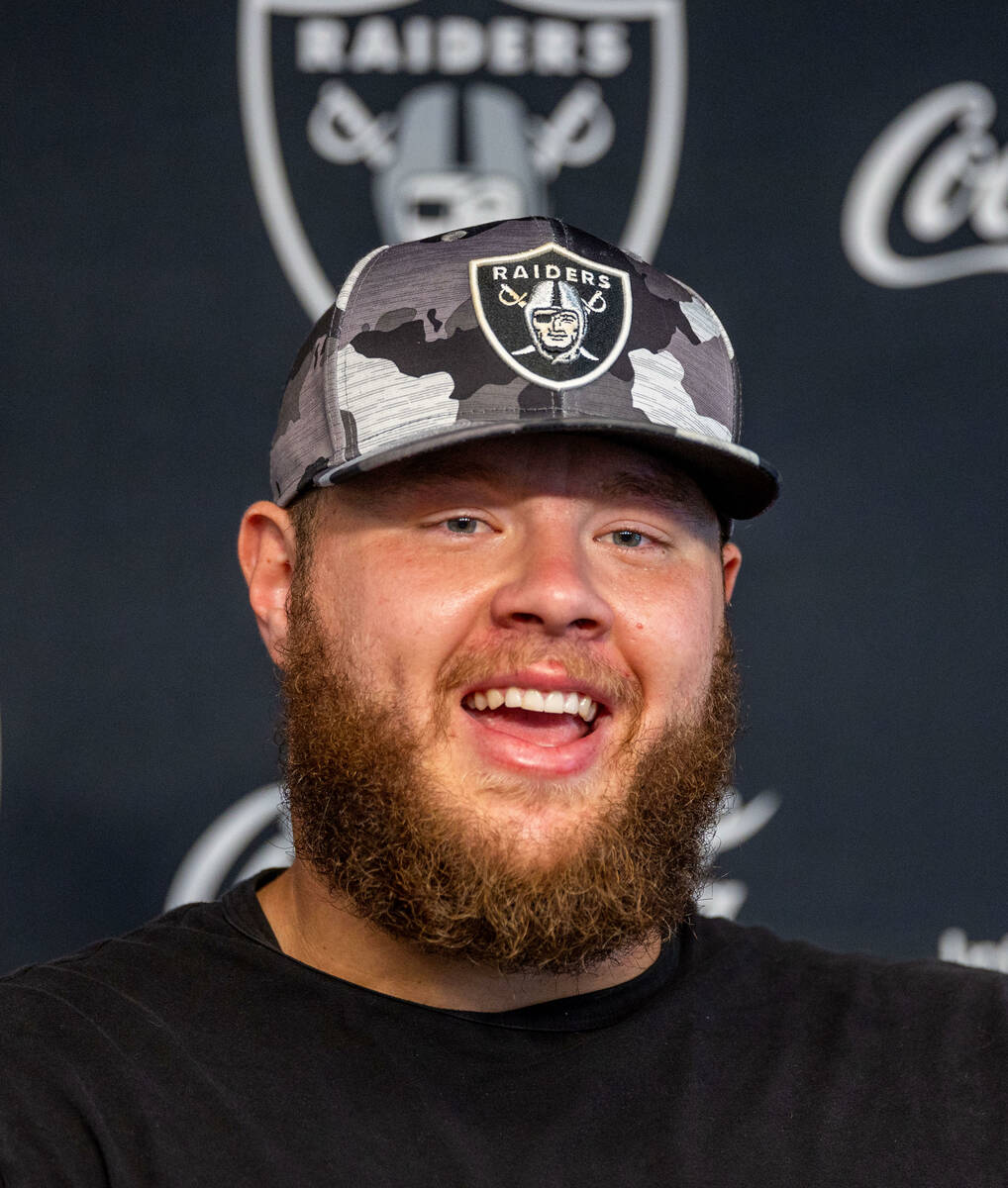 Raiders center Andre James (68) laughs at a question during a press conference in training camp ...