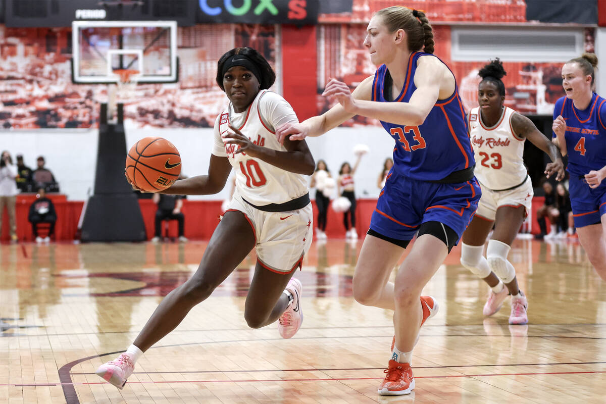 UNLV Lady Rebels guard Jasmyn Lott (10) drives toward the hoop against Boise State Broncos forw ...