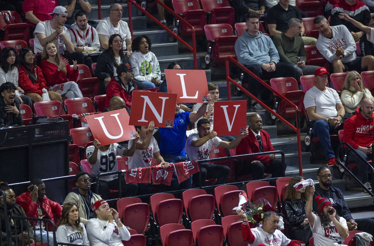 UNLV fans cheer during the first half of their NCAA men's basketball game against the San Diego ...