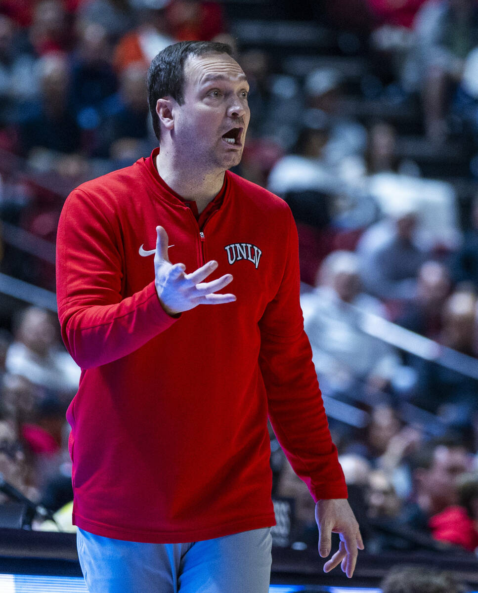 UNLV head coach Kevin Kruger directs his players against the San Diego State Aztecs during the ...