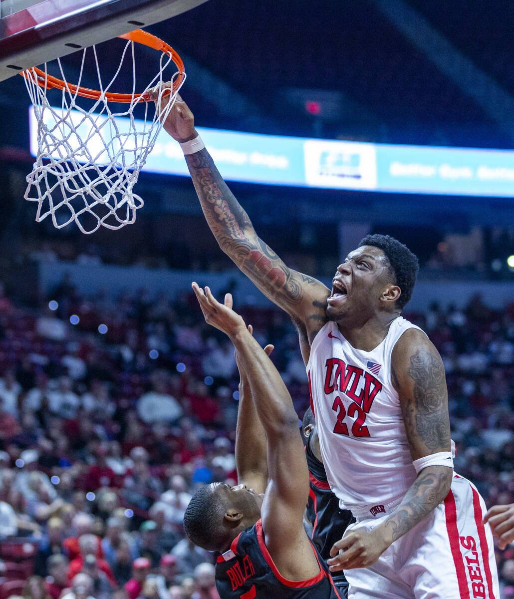 UNLV forward Karl Jones (22) misses a dunk attempt over San Diego State Aztecs guard Lamont But ...