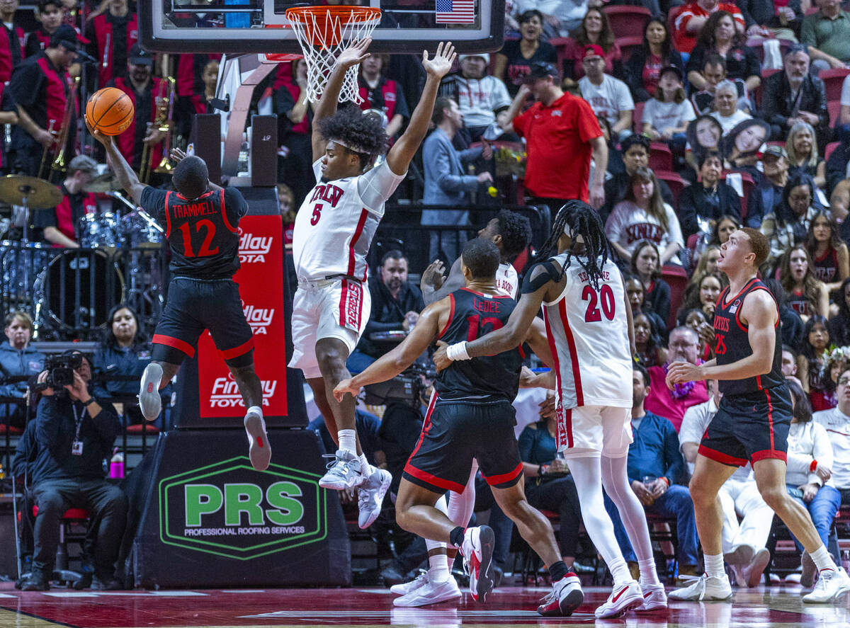 San Diego State Aztecs guard Darrion Trammell (12) creates some space for a shot against UNLV f ...