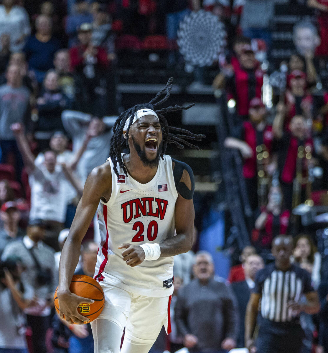 UNLV forward Keylan Boone (20) celebrates a critical turnover late in the game against the San ...