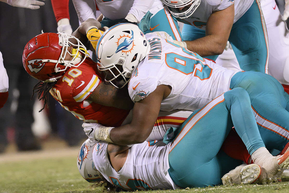 Miami Dolphins defensive tackle Christian Wilkins (94) tackles Kansas City Chiefs running back ...