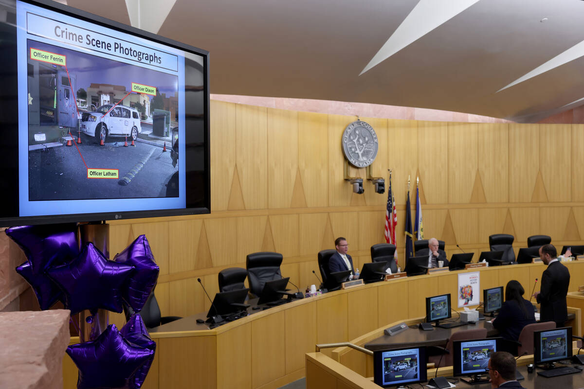 Photographs are shown as Detective Jason Leavitt, left, testifies during a fact-finding review ...