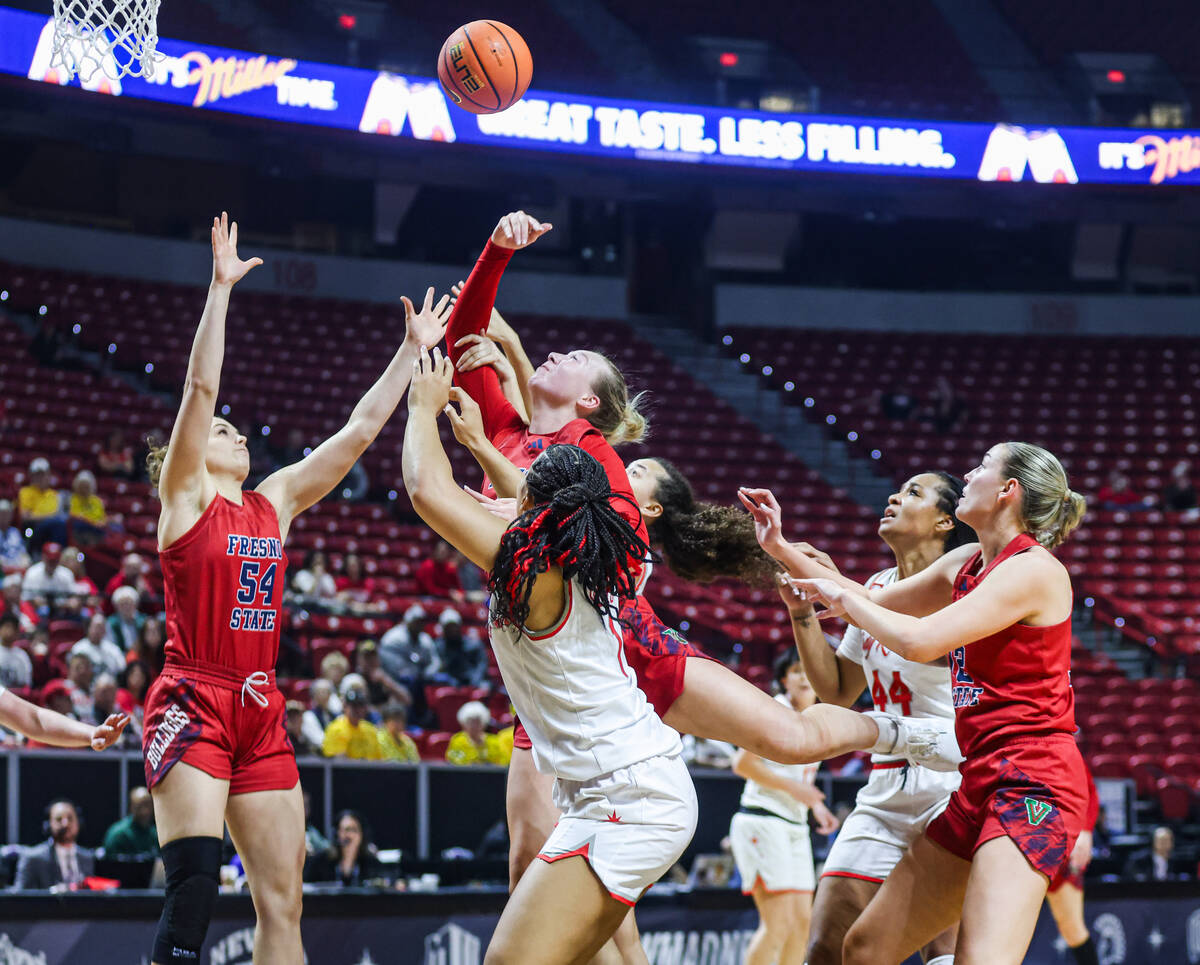Fresno State’s guard Franka Wittenberg (54), from left, forward Mia Jacobs (23) and UNLV ...