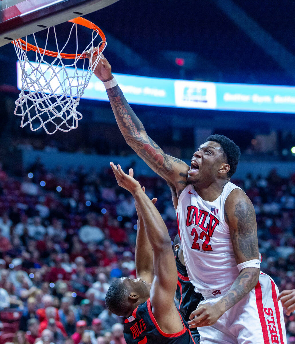 UNLV forward Karl Jones (22) misses a dunk attempt over San Diego State Aztecs guard Lamont But ...