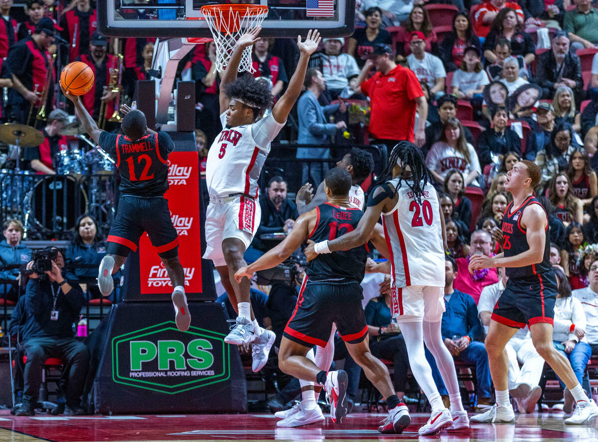 San Diego State Aztecs guard Darrion Trammell (12) creates some space for a shot against UNLV f ...