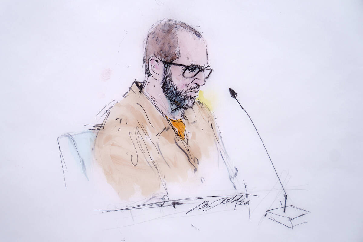 In this courtroom sketch, defendant Alexander Smirnov speaks in federal court in Los Angeles, M ...