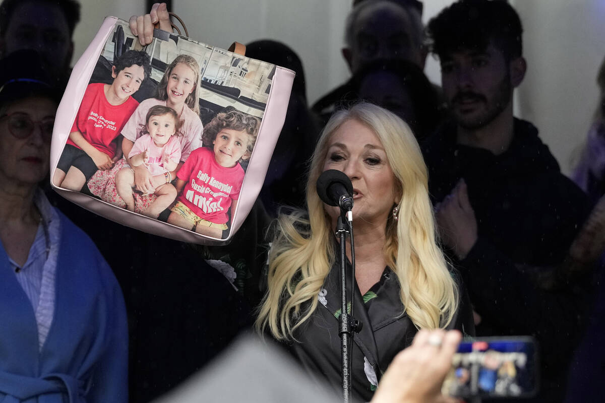 Vanessa Feltz, English TV personality and broadcaster, holds a bag picturing her grandchildren ...