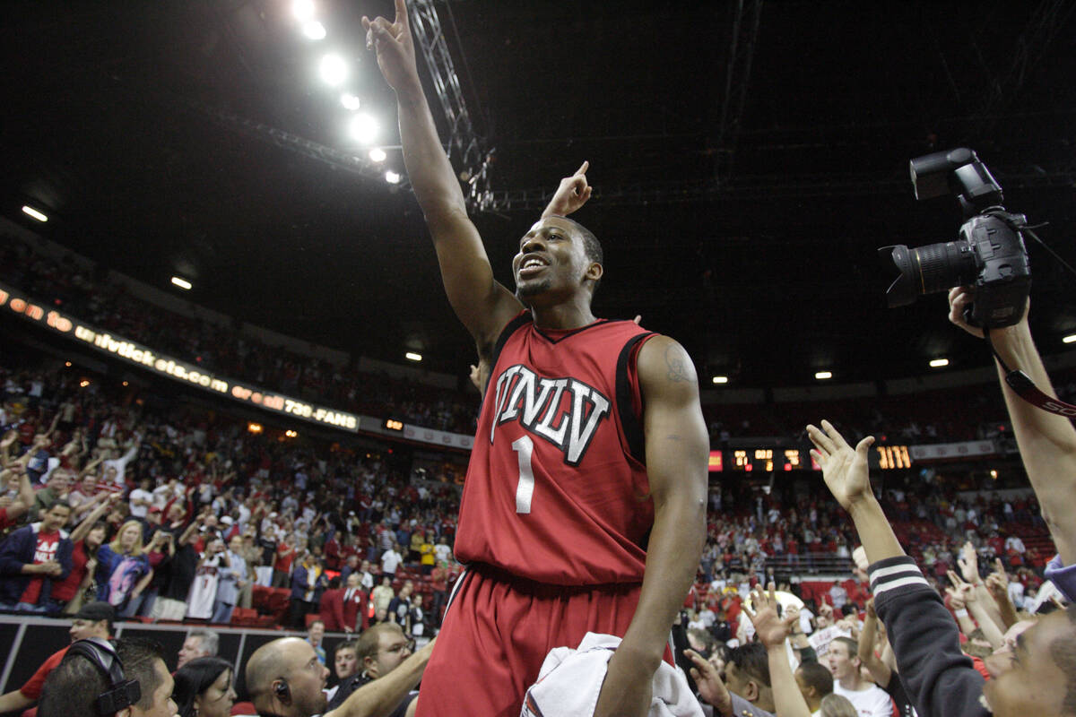 UNLV basketball player Wink Adams salutes fans after the Rebels won the Mountain West Conferenc ...