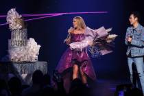 Carrie Underwood is shown with fan Jordan Huynh as the audience sings "Happy Birthday to You" t ...