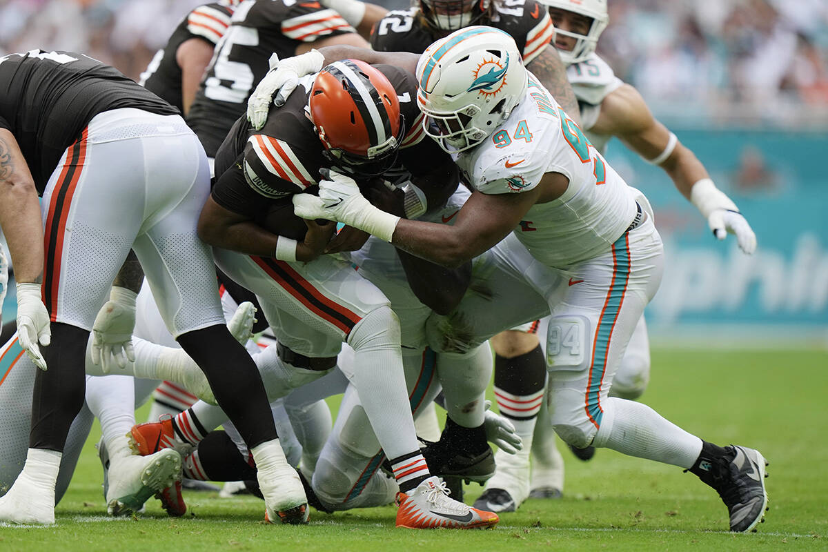 Miami Dolphins defensive tackle Christian Wilkins (94) sacks Cleveland Browns quarterback Jacob ...