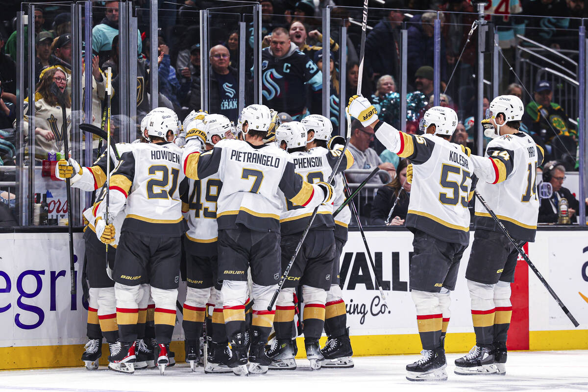 The Vegas Golden Knights celebrate after an overtime victory against the Seattle Kraken in an N ...