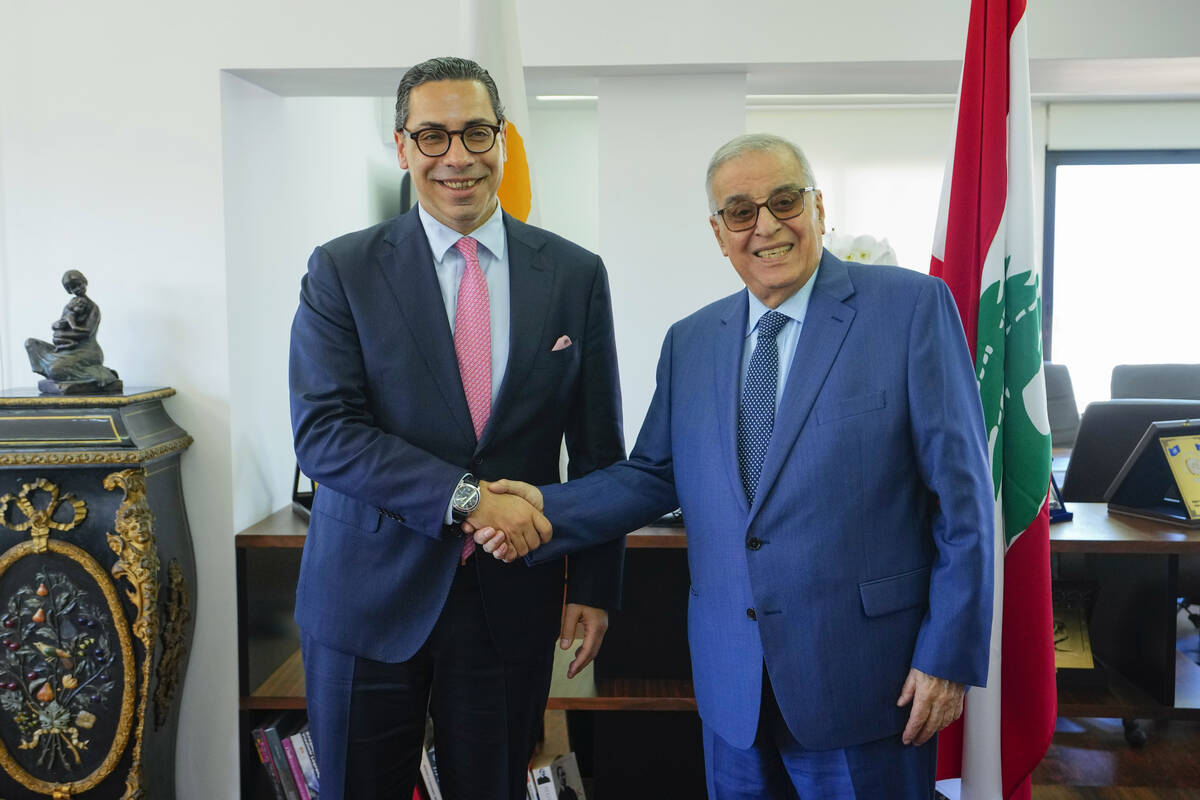 Lebanese Foreign Minister Abdallah Bouhabib, right, welcomes Cyprus Foreign Minister Constantin ...