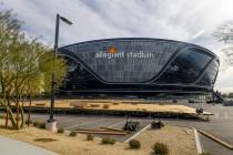 A platform is constructed in a parking lot as Super Bowl preparations continue at Allegiant Sta ...