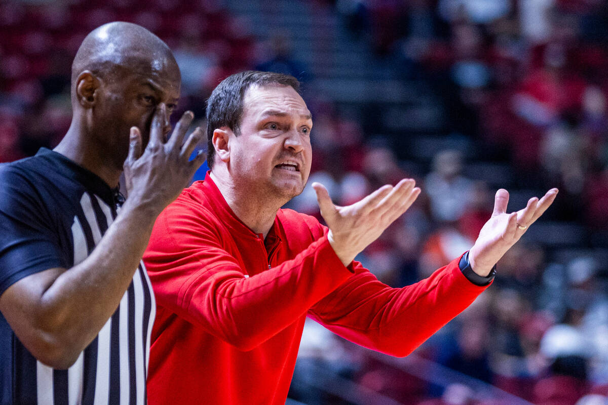 UNLV head coach Kevin Kruger makes his appeal with the refereee against the San Diego State Azt ...