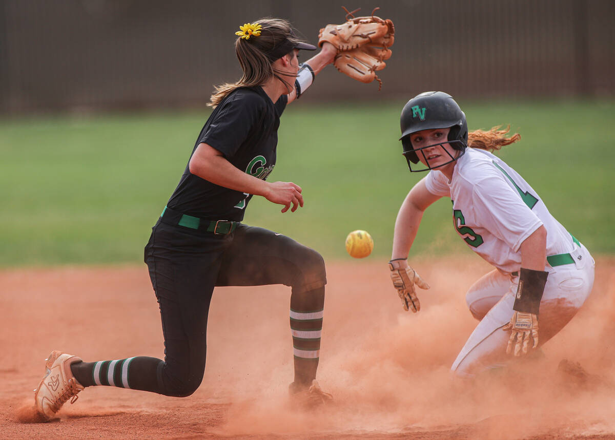 Palo Verde’s Mya Bartlett (18) slides in safe past Green Valley’s Michaela Morris ...