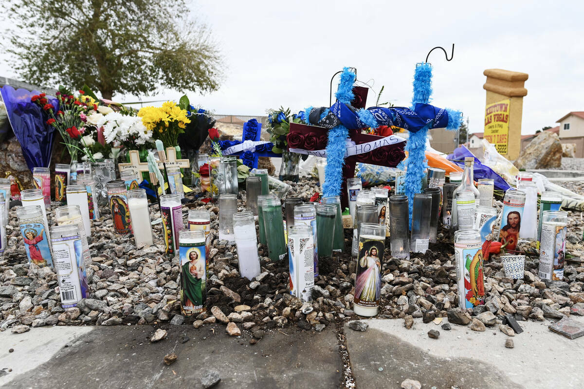 An impromptu memorial for two teens who were killed after running a red light is seen Tuesday, ...