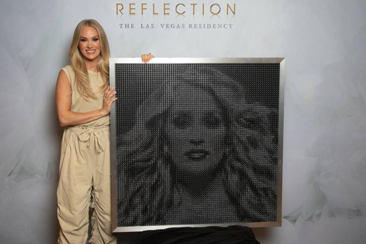 Carrie Underwood is shown with the dice clock AEG Presents presented to her for her 41st birthd ...