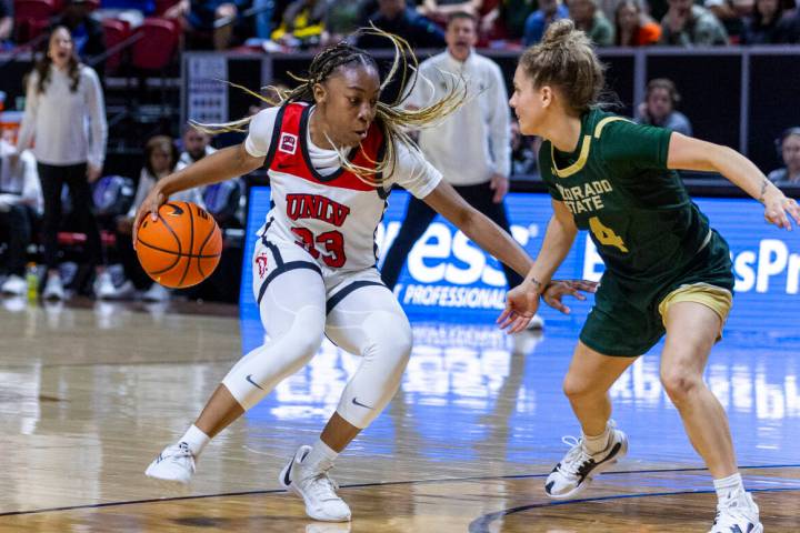 UNLV Lady Rebels guard Amarachi Kimpson (33) battles for the lane against Colorado State Rams g ...