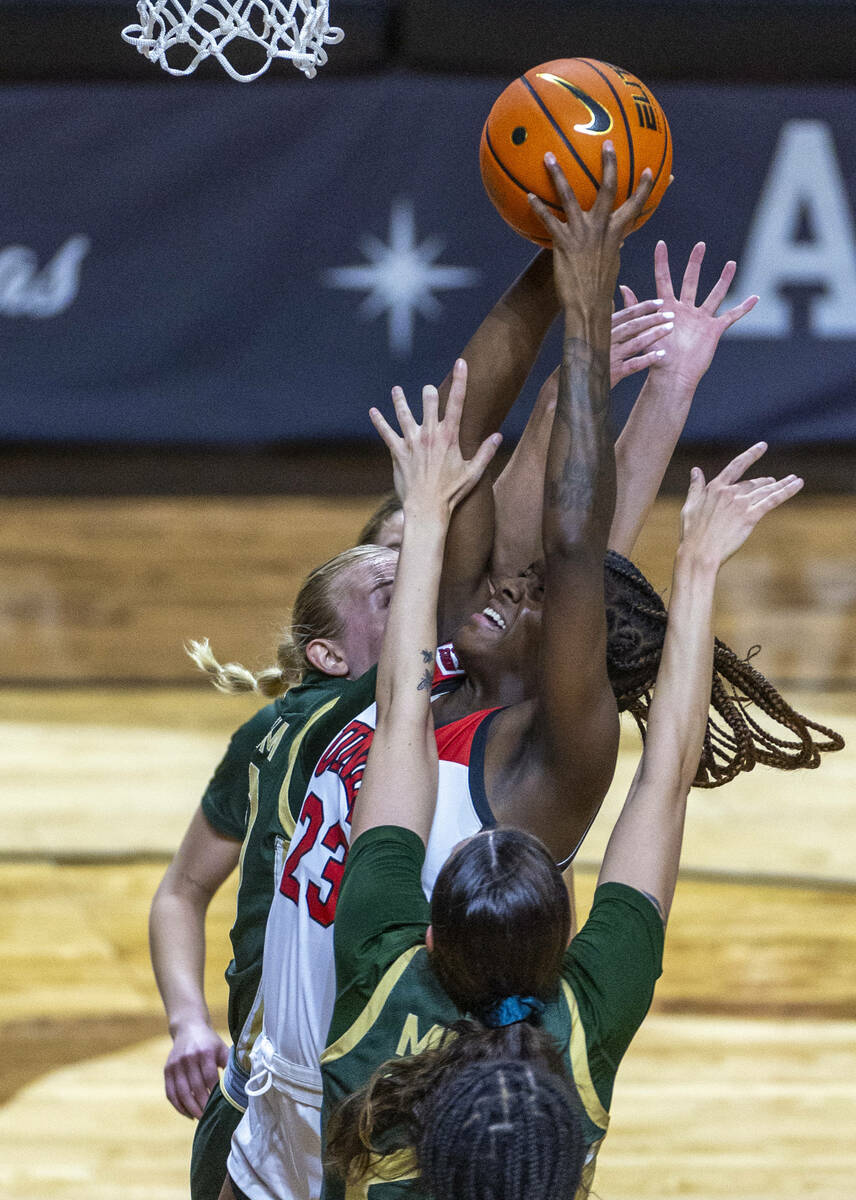 UNLV Lady Rebels center Desi-Rae Young (23) goes back up in traffic under the basket against Co ...