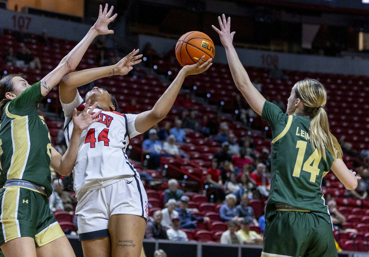 UNLV Lady Rebels forward Alyssa Brown (44) battles to get off a shot against the defense of Col ...