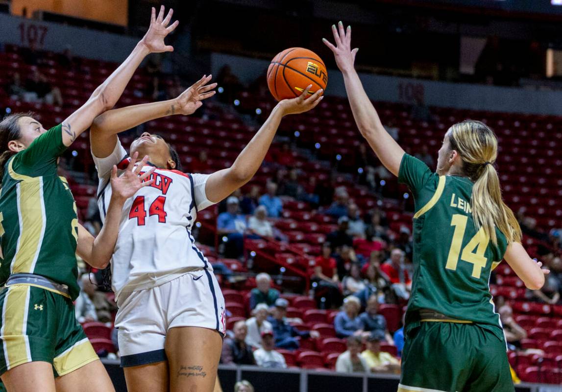 UNLV Lady Rebels forward Alyssa Brown (44) battles to get off a shot against the defense of Col ...