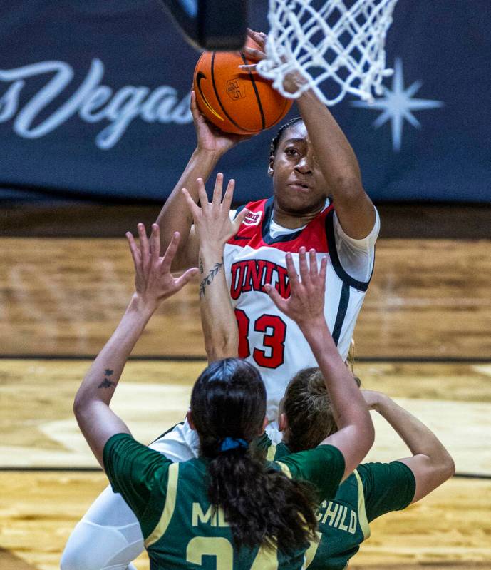 UNLV Lady Rebels guard Amarachi Kimpson (33) looks to shoot over Colorado State Rams guard McKe ...