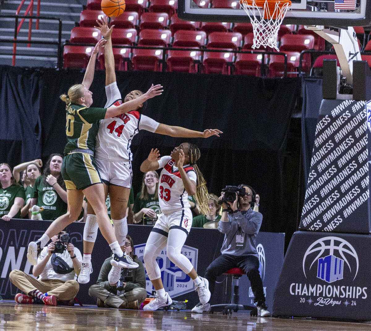 UNLV Lady Rebels forward Alyssa Brown (44) blocks a shot attempt by Colorado State Rams guard S ...