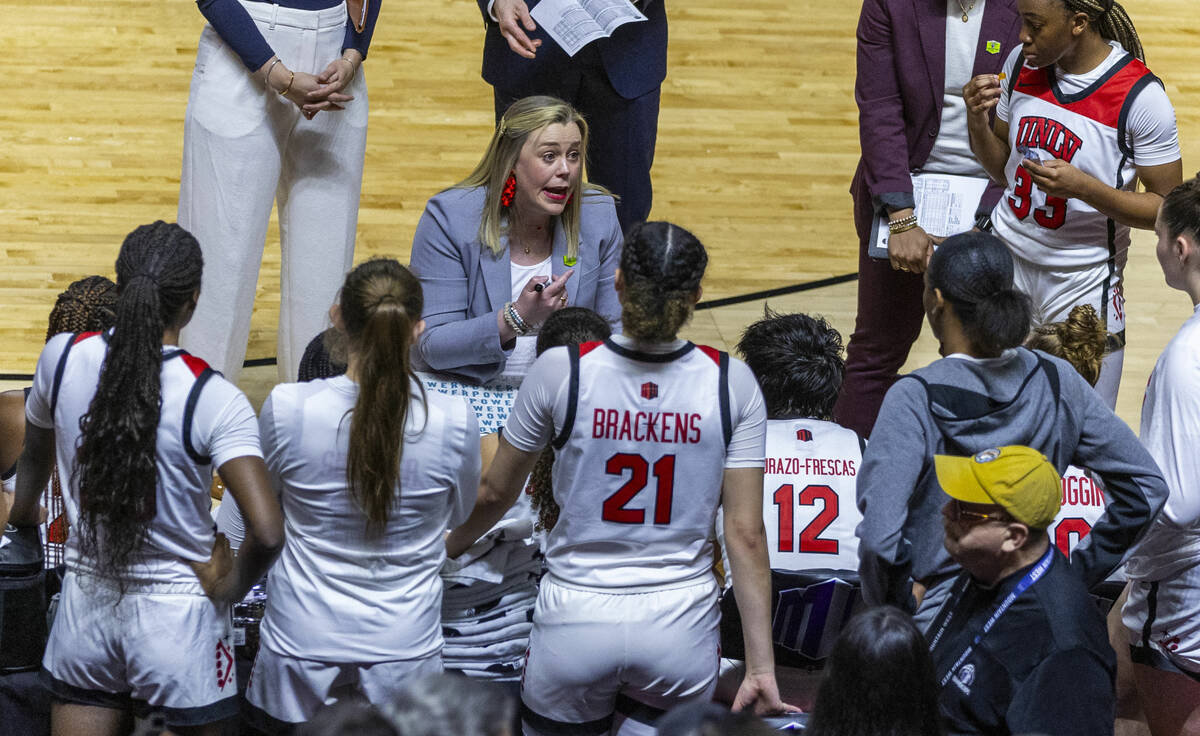 UNLV Lady Rebels head coach Lindy La Rocque counsels her players on a timeout against the Color ...