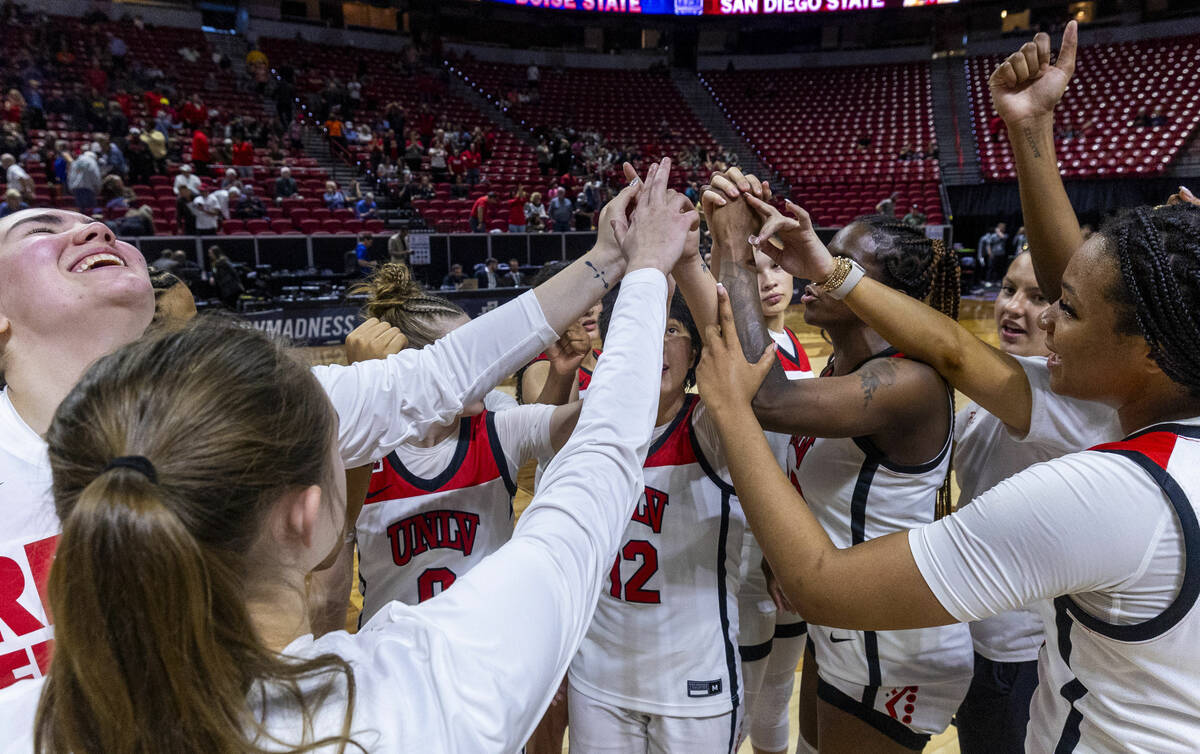 UNLV players come together after defeating the Colorado State Rams 62-52 after the second half ...