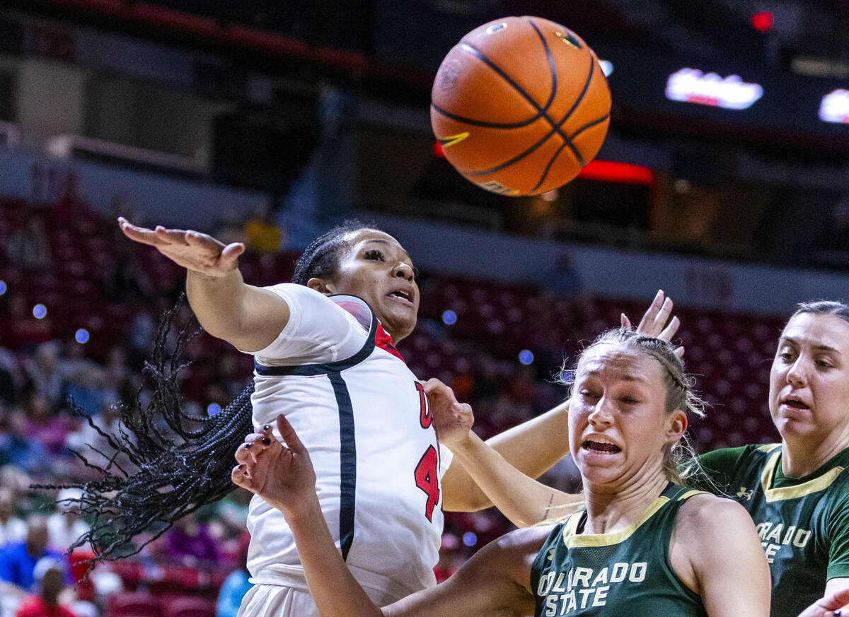 UNLV Lady Rebels forward Alyssa Brown (44) slaps away a loose ball from Colorado State Rams gua ...